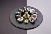 japanese sushi on a black plate